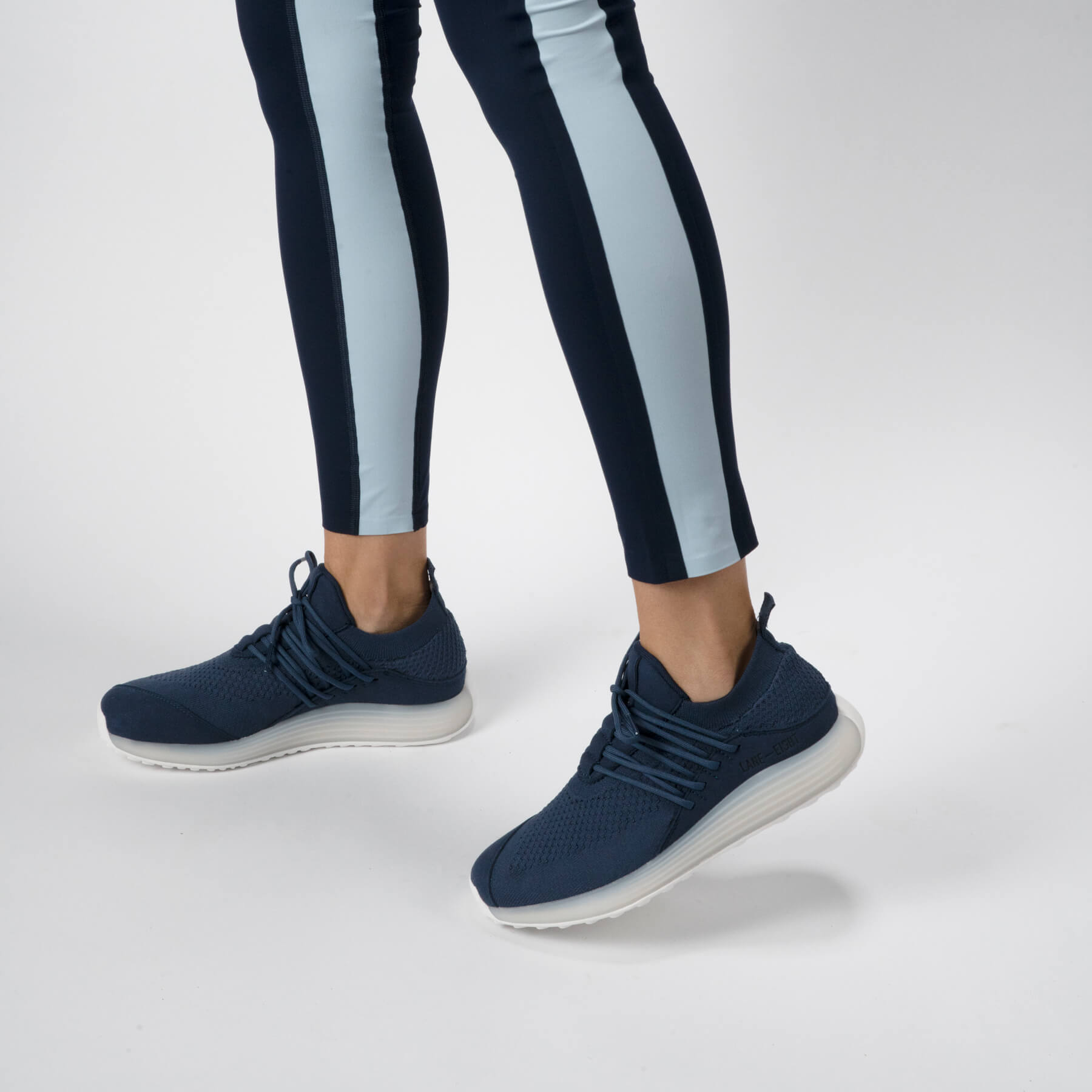 LANEEIGHT-TRAINER-AD-1-DeepBlue-WomensOnFoot.jpg