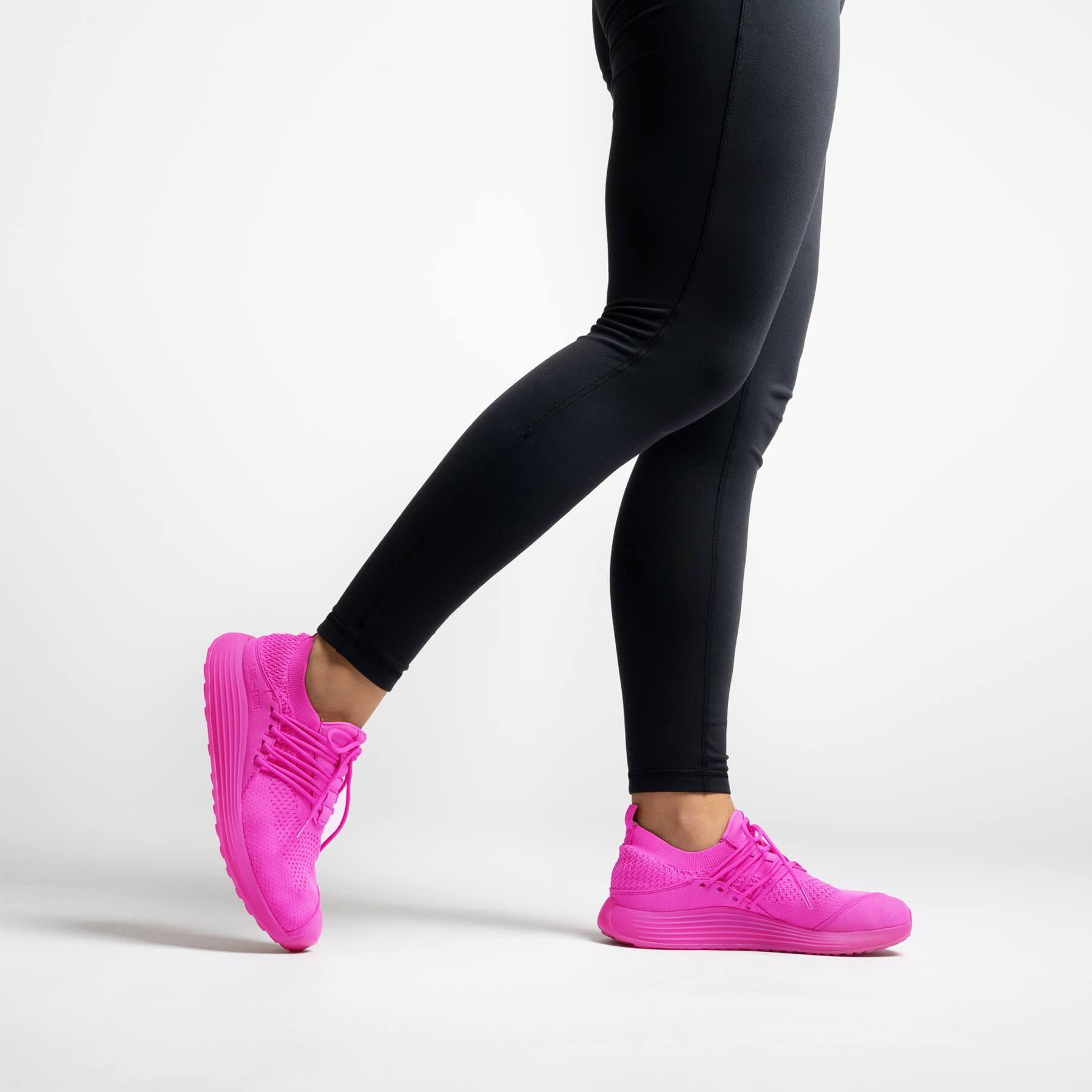 LANEEIGHT-TRAINER-AD-1-HyperPink-WomensOnFoot-1.jpg