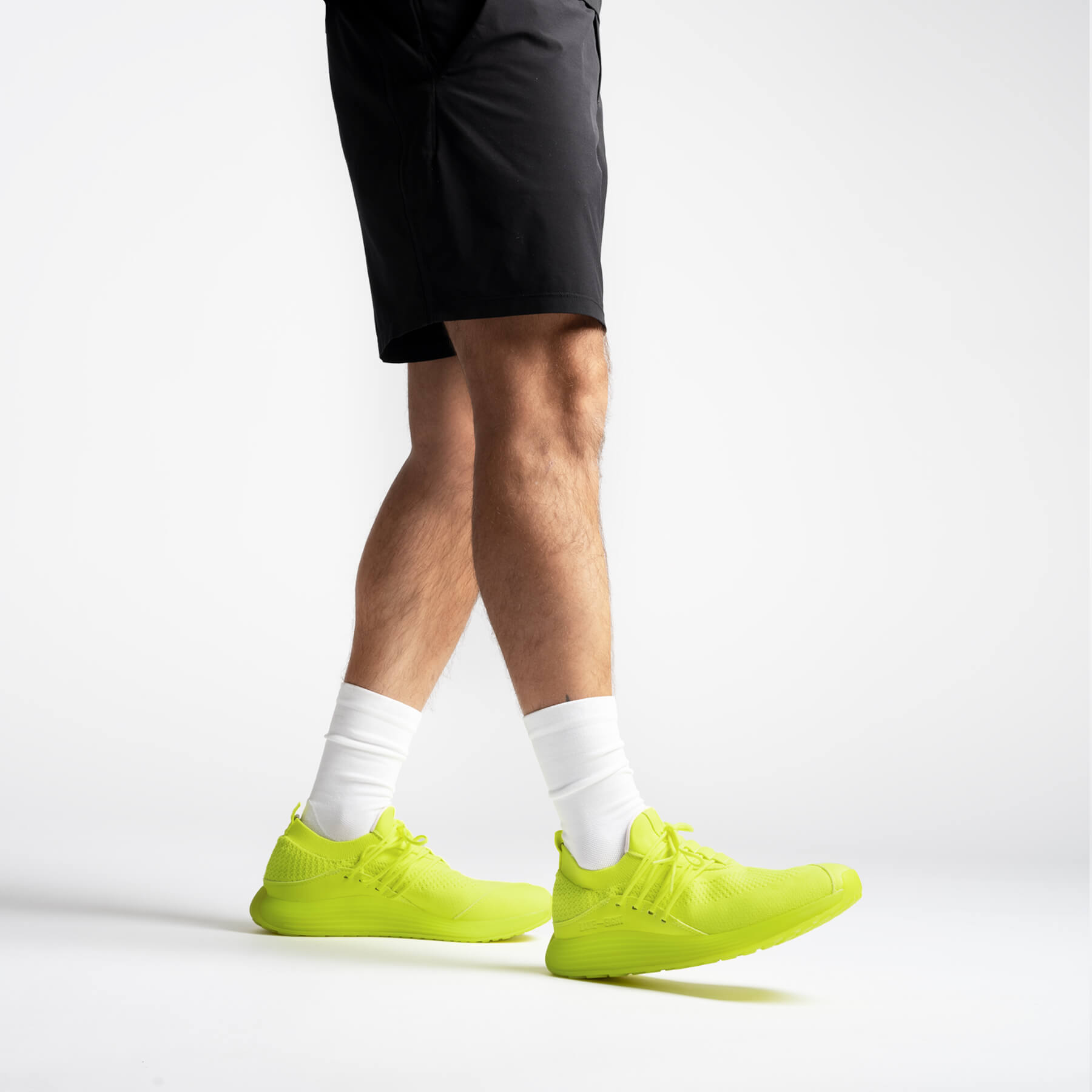 LANEEIGHT-TRAINER-AD-1-ElectricYellow-MensOnFoot.jpg