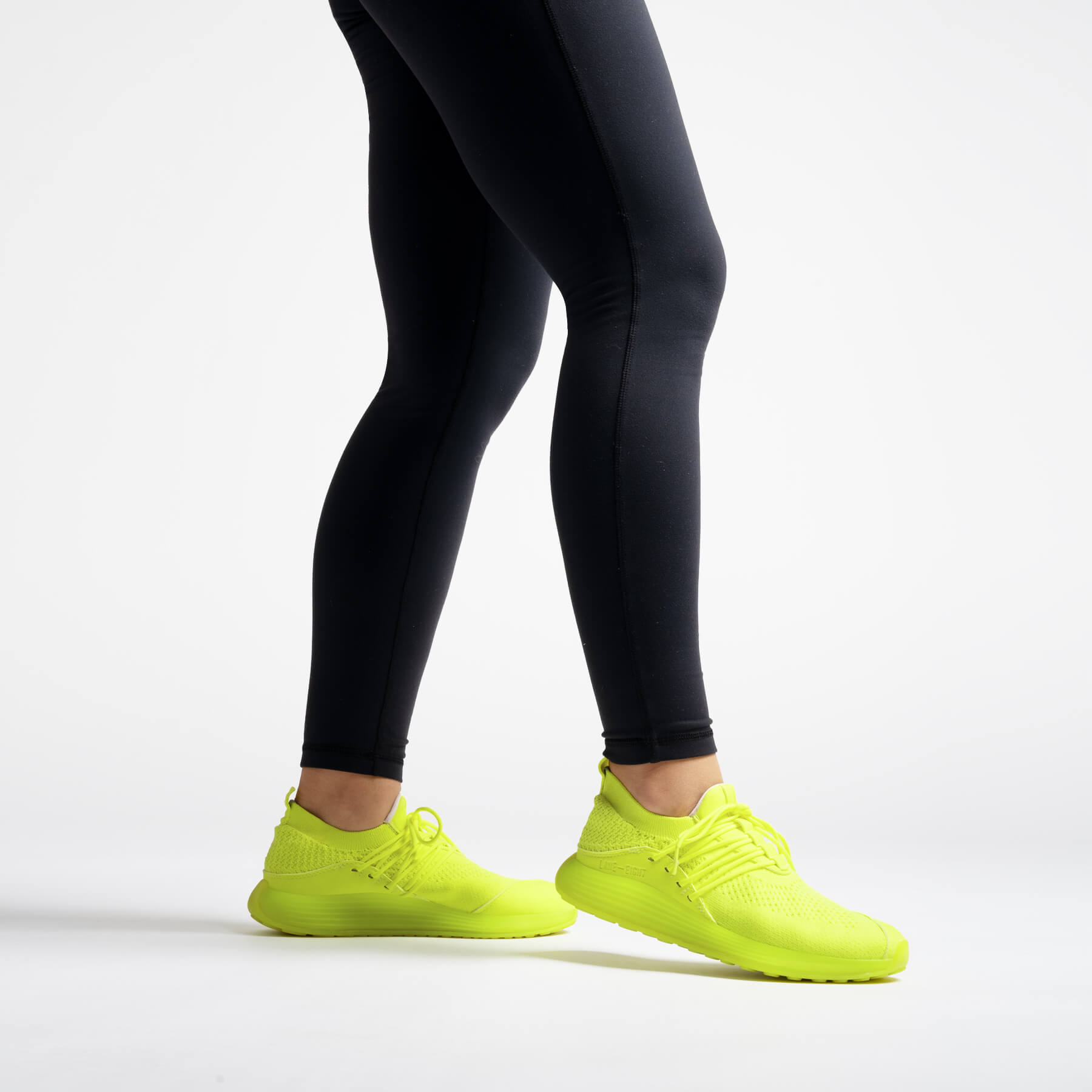 LANEEIGHT-TRAINER-AD-1-ElectricYellow-WomensOnFoot.jpg